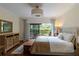 Bright bedroom with deck access, hard wood floors and ample natural light at 5230 Lake Arrowhead Trl # 29, Sarasota, FL 34231