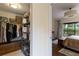 Well-organized walk-in closet with shelving, hanging racks, and storage bench at 5230 Lake Arrowhead Trl # 29, Sarasota, FL 34231