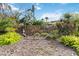 Stone sign reading 'Lake Arrowhead' amidst lush greenery, creating a welcoming entrance to the neighborhood at 5230 Lake Arrowhead Trl # 29, Sarasota, FL 34231