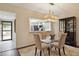 Cozy dining area with glass table, set on a decorative rug, with a pass-through to the kitchen at 5230 Lake Arrowhead Trl # 29, Sarasota, FL 34231