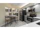 Stylish kitchen with stainless steel appliances, breakfast table, and bright natural light at 5230 Lake Arrowhead Trl # 29, Sarasota, FL 34231