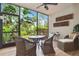 Relaxing screened lanai with comfortable seating and views of lush landscaping at 5230 Lake Arrowhead Trl # 29, Sarasota, FL 34231