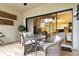 Enclosed lanai with tile flooring, comfortable seating, and a view into the interior living area at 5230 Lake Arrowhead Trl # 29, Sarasota, FL 34231