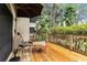 Inviting patio with lounge chairs, table, and views of lush greenery at 5230 Lake Arrowhead Trl # 29, Sarasota, FL 34231