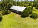 Aerial view of home and lush green landscape, showcasing the property's serene setting at 5242 Blackjack Cir, Punta Gorda, FL 33982