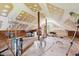 Large unfinished attic with wooden floors and beams, offering potential for customization at 5242 Blackjack Cir, Punta Gorda, FL 33982