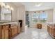 Spacious bathroom with wooden vanities, granite countertops, and a tub/shower combo at 5242 Blackjack Cir, Punta Gorda, FL 33982