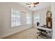 Bright bedroom with two large windows, neutral paint and carpet, and ceiling fan at 5242 Blackjack Cir, Punta Gorda, FL 33982