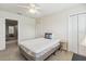 Cozy bedroom features a twin bed, neutral colors, and a ceiling fan at 5242 Blackjack Cir, Punta Gorda, FL 33982