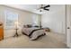 Comfortable bedroom with two windows, ceiling fan, and neutral carpeting at 5242 Blackjack Cir, Punta Gorda, FL 33982
