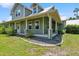 Inviting home with a wraparound porch and beautifully landscaped surroundings at 5242 Blackjack Cir, Punta Gorda, FL 33982