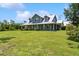 Beautiful home with a large front yard and a classic covered porch, perfect for relaxing at 5242 Blackjack Cir, Punta Gorda, FL 33982