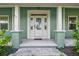 Inviting front porch with sturdy columns, perfect for relaxing and enjoying the outdoors at 5242 Blackjack Cir, Punta Gorda, FL 33982