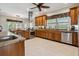 Spacious kitchen featuring custom wood cabinets, stainless steel appliances, and granite countertops at 5242 Blackjack Cir, Punta Gorda, FL 33982