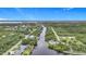 Stunning aerial view of a waterfront community with lush greenery and navigable canals at 576 Mcdill Dr, Port Charlotte, FL 33953