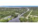 Beautiful aerial view of waterfront homes nestled among canals and mature trees at 576 Mcdill Dr, Port Charlotte, FL 33953