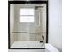Stylish bathroom featuring a glass-enclosed shower, tiled walls, and modern fixtures at 576 Mcdill Dr, Port Charlotte, FL 33953