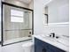 Contemporary bathroom with a vanity, framed glass shower, and modern fixtures at 576 Mcdill Dr, Port Charlotte, FL 33953