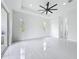 Spacious bedroom with bright natural light and white tile floors at 576 Mcdill Dr, Port Charlotte, FL 33953
