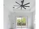 Bedroom featuring a ceiling fan and sliding glass doors to the outside at 576 Mcdill Dr, Port Charlotte, FL 33953