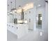 Modern kitchen with large island, white cabinets, stainless steel appliances and stylish pendant lighting at 576 Mcdill Dr, Port Charlotte, FL 33953