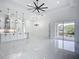 Bright living space with modern kitchen and glass doors leading to outdoor patio at 576 Mcdill Dr, Port Charlotte, FL 33953