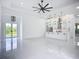Open floorplan features a bright living room and a modern kitchen with stainless steel appliances at 576 Mcdill Dr, Port Charlotte, FL 33953