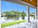 A beautiful patio with a scenic view of a waterway and lush greenery at 576 Mcdill Dr, Port Charlotte, FL 33953
