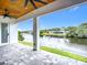An inviting patio with a scenic view of a peaceful waterway and lush trees at 576 Mcdill Dr, Port Charlotte, FL 33953