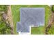 Aerial view of a well maintained tile roof with lush landscaping at 576 Mcdill Dr, Port Charlotte, FL 33953