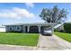 Charming one-story home with covered parking and well-maintained lawn at 6196 Mayberry Ave, North Port, FL 34287