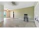 Spacious living room with exposed flooring and natural lighting at 6196 Mayberry Ave, North Port, FL 34287