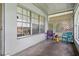 Cozy porch with lattice accents, seating, and natural light at 6196 Mayberry Ave, North Port, FL 34287