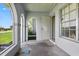 Covered porch with arched openings and views of the outdoors at 6196 Mayberry Ave, North Port, FL 34287