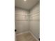 Spacious walk-in closet featuring modern shelving and ample storage for clothing and personal items at 7052 Legion St, Port Charlotte, FL 33981