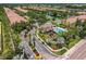 Aerial view of a community with a pool, a small lake and lush landscaping and attractive buildings at 8098 Moonstone Dr # 17-203, Sarasota, FL 34233