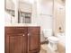 Bathroom featuring a dark wood vanity, shower-tub combo, and neutral tile flooring at 8098 Moonstone Dr # 17-203, Sarasota, FL 34233