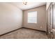 Bright bedroom with window, neutral walls, carpet, and a closet providing a serene living space at 8098 Moonstone Dr # 17-203, Sarasota, FL 34233