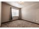 Bright bedroom with large window and neutral carpet, offering a calm and inviting space at 8098 Moonstone Dr # 17-203, Sarasota, FL 34233