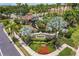 Well manicured entrance to the Stonehaven community, lush landscaping and the community sign at 8098 Moonstone Dr # 17-203, Sarasota, FL 34233