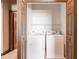 Laundry room featuring a white washer and dryer inside the closet at 8098 Moonstone Dr # 17-203, Sarasota, FL 34233