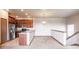 Open floor plan with view of kitchen featuring stainless appliances and raised breakfast bar at 8098 Moonstone Dr # 17-203, Sarasota, FL 34233