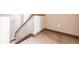 A carpeted stairway with wooden handrail and baseboards; an inviting transition within the home at 8098 Moonstone Dr # 17-203, Sarasota, FL 34233