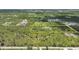 Expansive aerial view of the property showcasing its size, location, and surrounding natural landscape at 8312 Acorn Blvd, Punta Gorda, FL 33982
