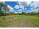 Spacious backyard with a charming flower garden, ideal for relaxation and enjoying nature at 8312 Acorn Blvd, Punta Gorda, FL 33982