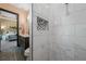 A tiled shower featuring a built-in niche complements this lovely bathroom at 8312 Acorn Blvd, Punta Gorda, FL 33982