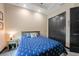 A well-lit bedroom has a queen bed with a blue patterned comforter and side table at 8312 Acorn Blvd, Punta Gorda, FL 33982