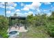Outdoor duck enclosure with pond and shaded shelter, providing a safe and comfortable habitat at 8312 Acorn Blvd, Punta Gorda, FL 33982