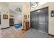 Inviting home entryway showcasing wood flooring, an elegant area rug, and striking double doors at 8312 Acorn Blvd, Punta Gorda, FL 33982