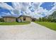 Exterior view of home showcasing well-maintained landscaping and backyard at 8312 Acorn Blvd, Punta Gorda, FL 33982